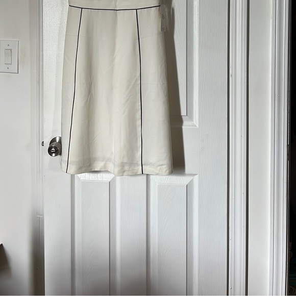 Off white knee length dress with black piping in size 10. Never been worn. - Picture 1 of 6